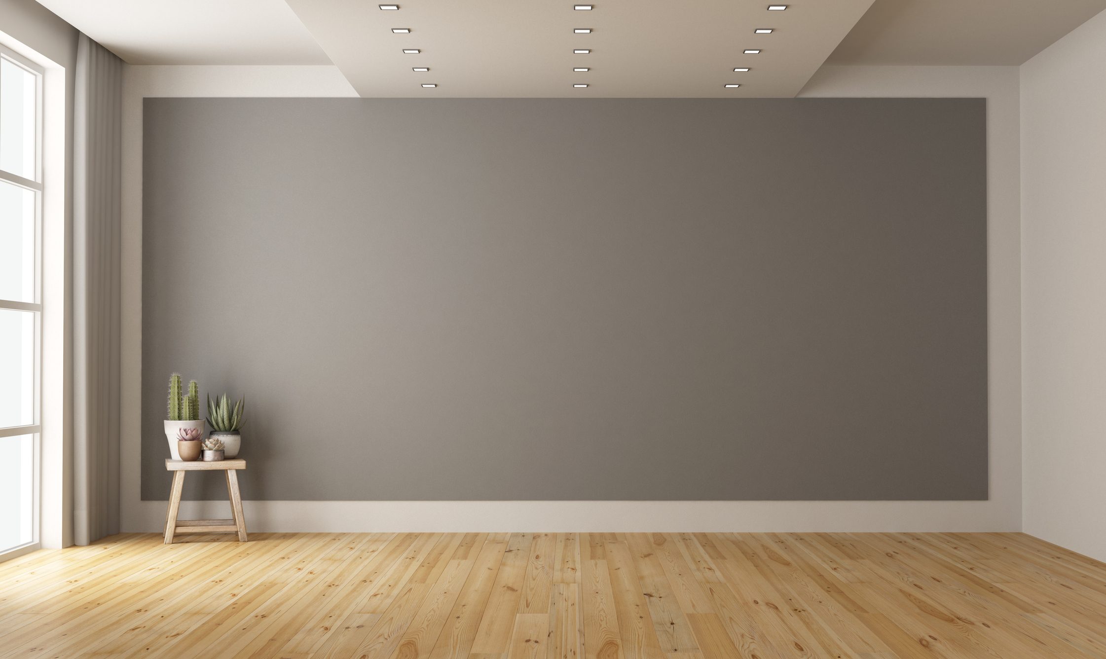 Stanza quasi vuota, molto spaziosa e luminosa con pavimento in parquet.